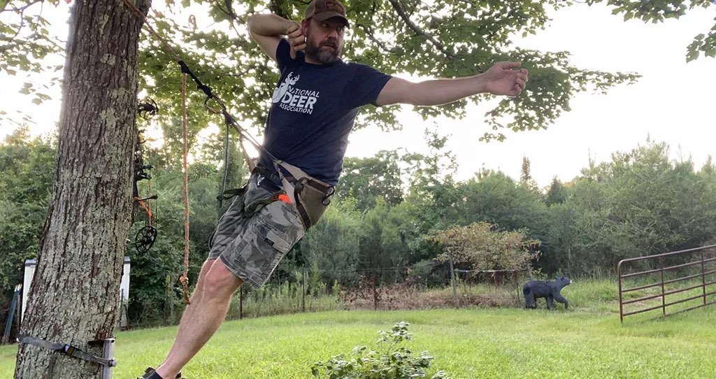 The author practicing in his hunting saddle in a tree.