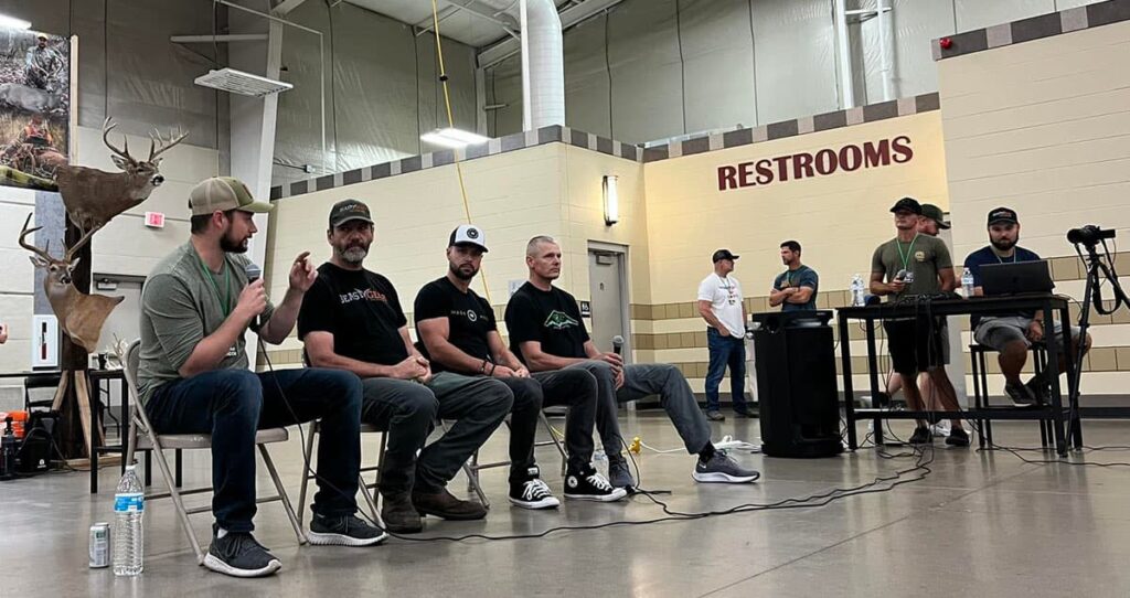 A line of seminar speakers for a Q&A session.