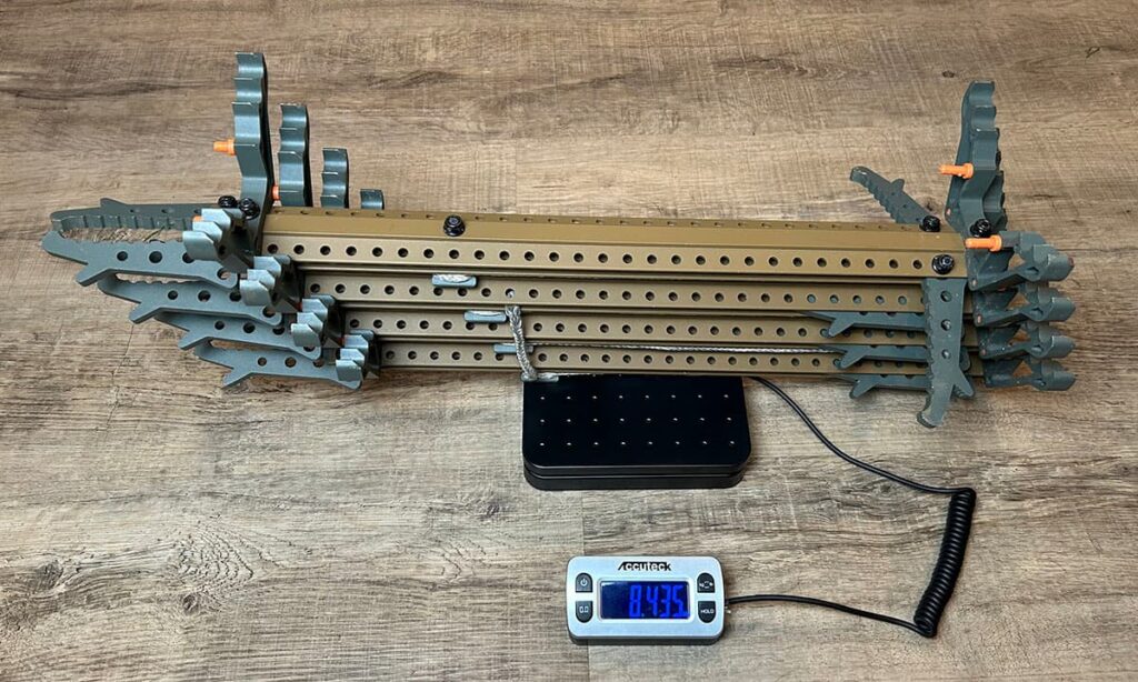 Tethrd Skeletor sticks sitting on a postal scale.