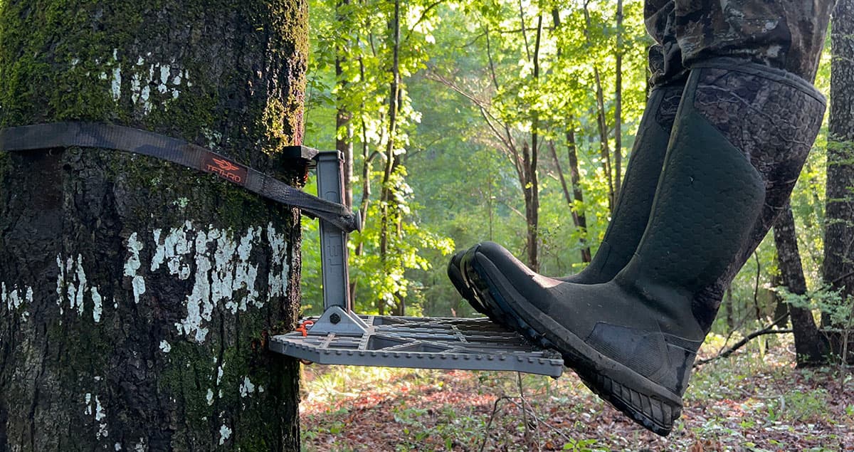 The author standing on the edge of a Tethrd Predator XL saddle hunting platform.